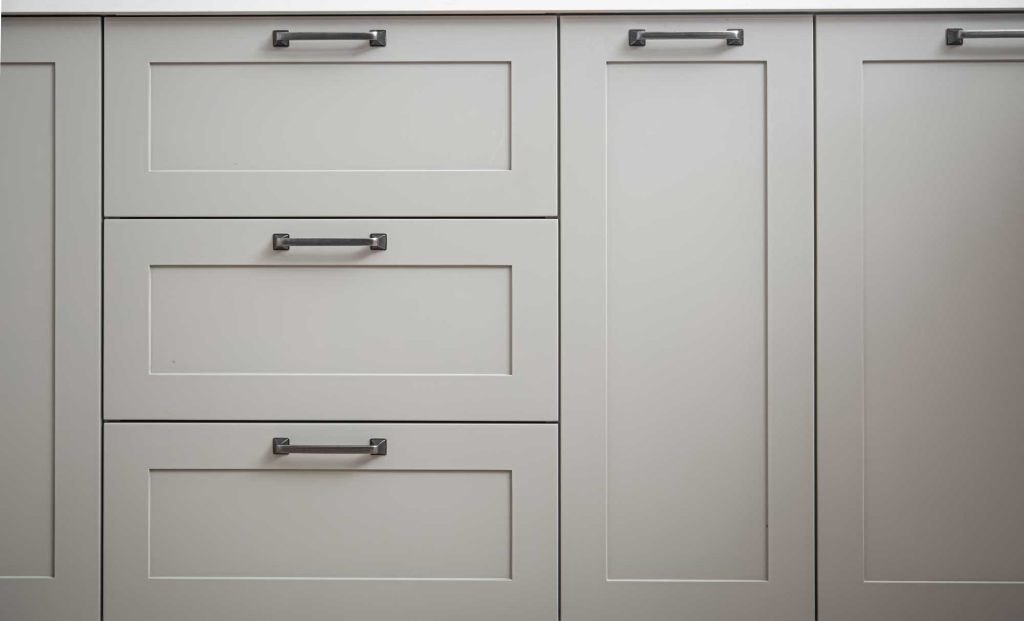 A close of up some cabinets with custom hardware isntalled by Custom Decorators Co